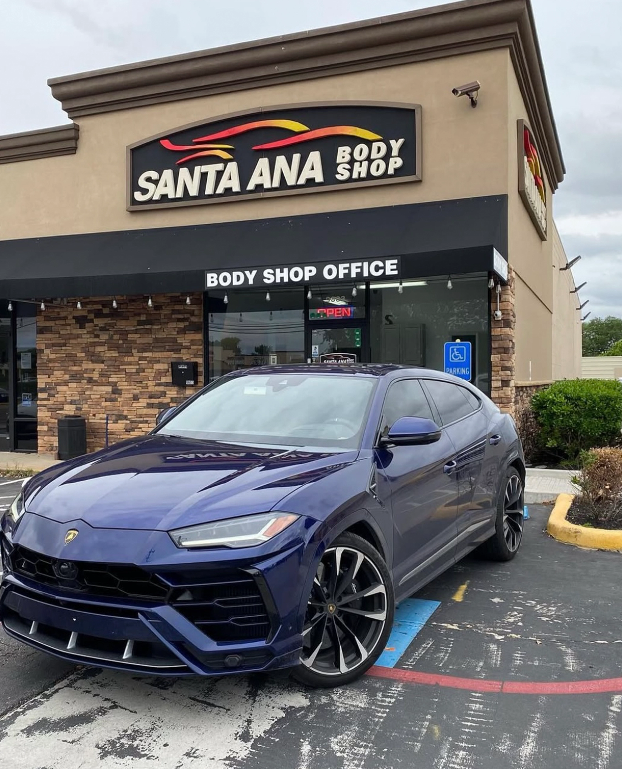 Sports car parked outside santa ana body shop